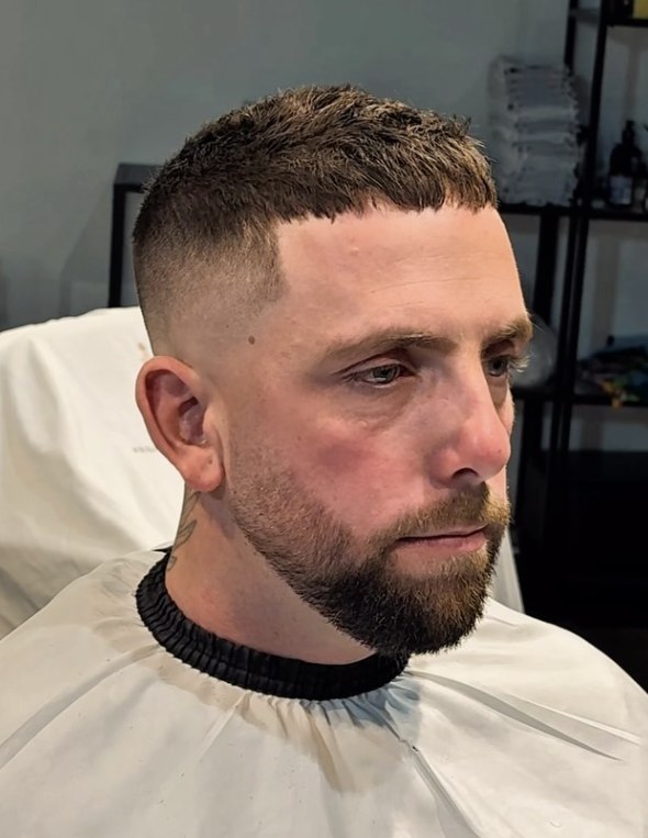 French crop with a mid fade and beard